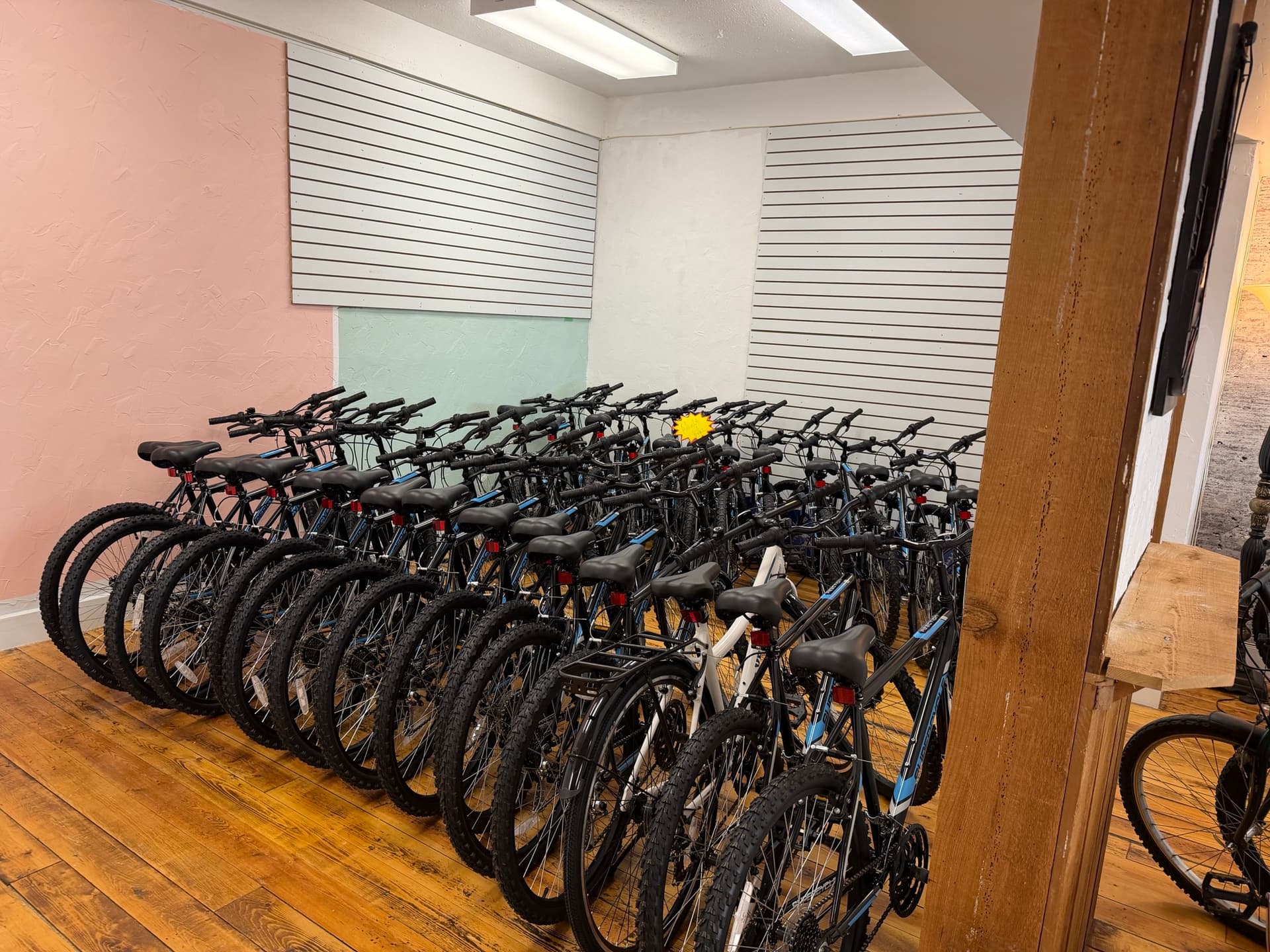 Rows of rental bikes inside Wander Bike Rentals