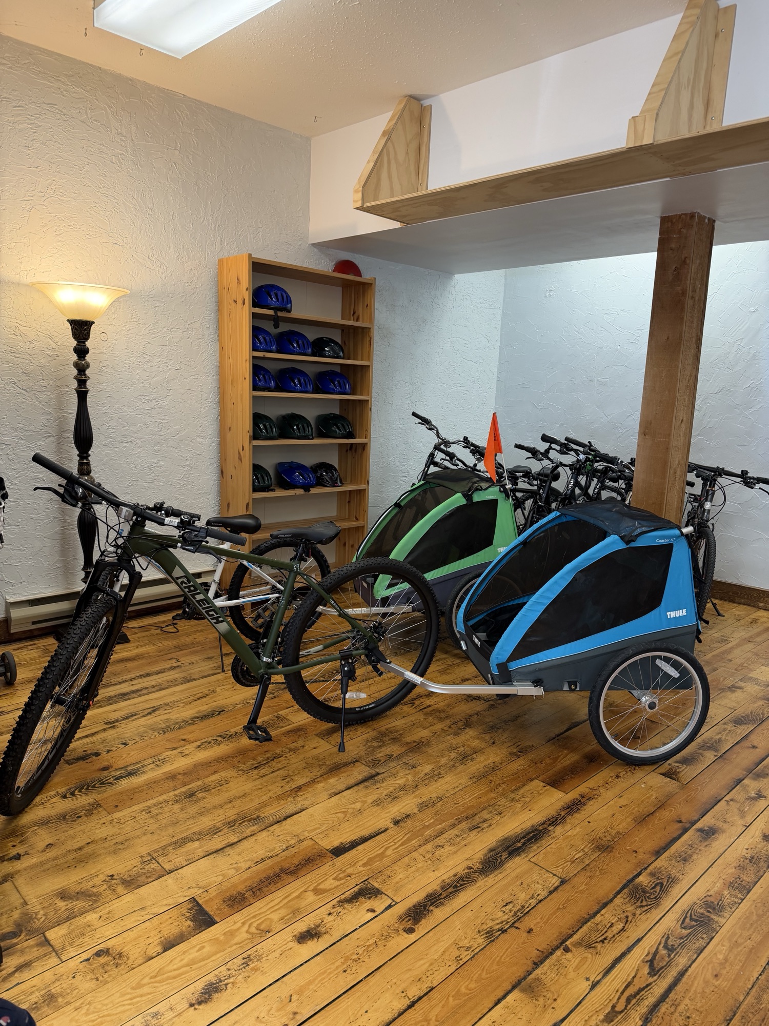 Bike with a family trailer inside Wander Bike Rentals
